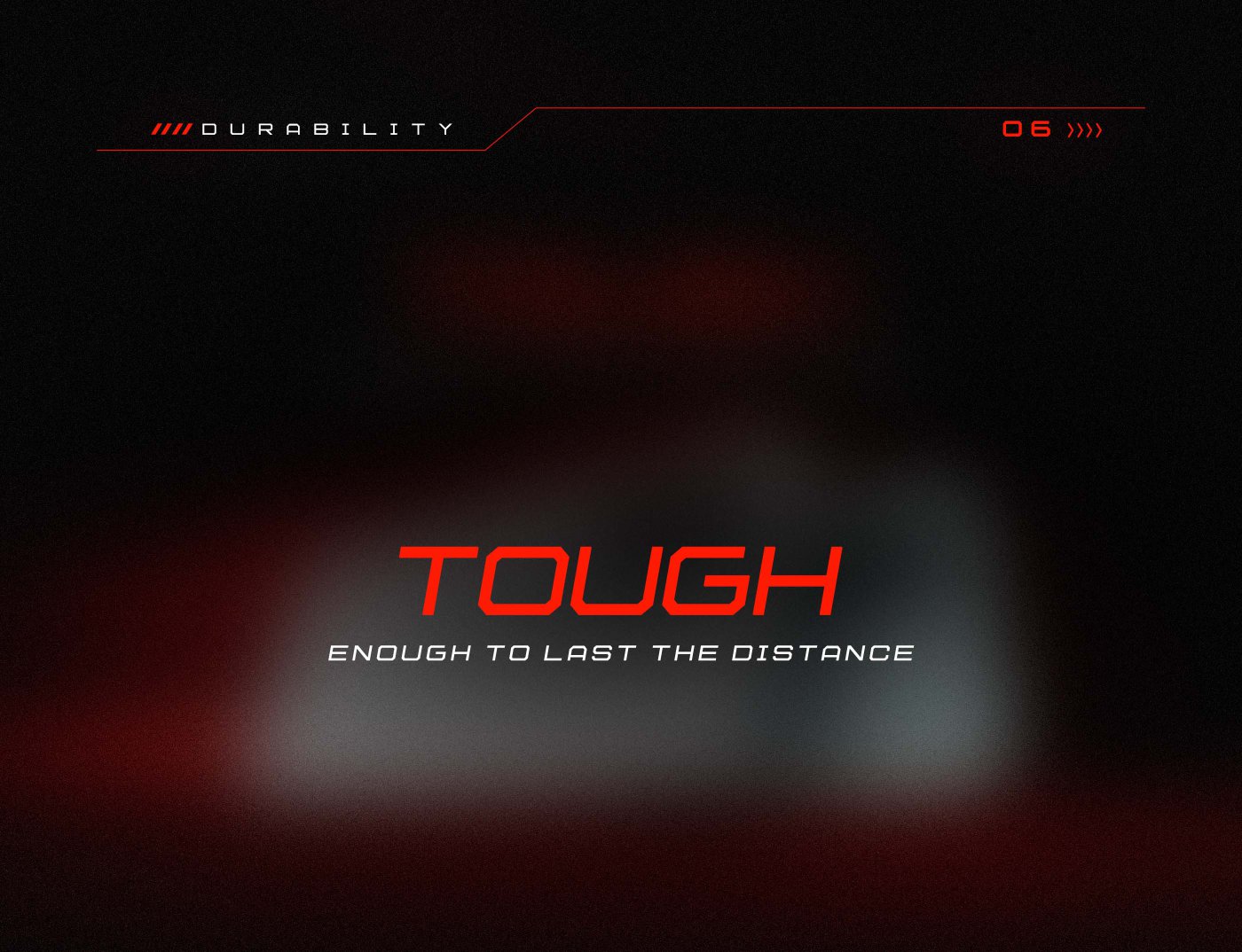 The image contains a design with the text "TOUGH" in large, bold red letters, followed by the phrase "ENOUGH TO LAST THE DISTANCE" in smaller white text. The background is dark with a gradient effect, and there are graphical elements indicating "DURABILITY" at the top.