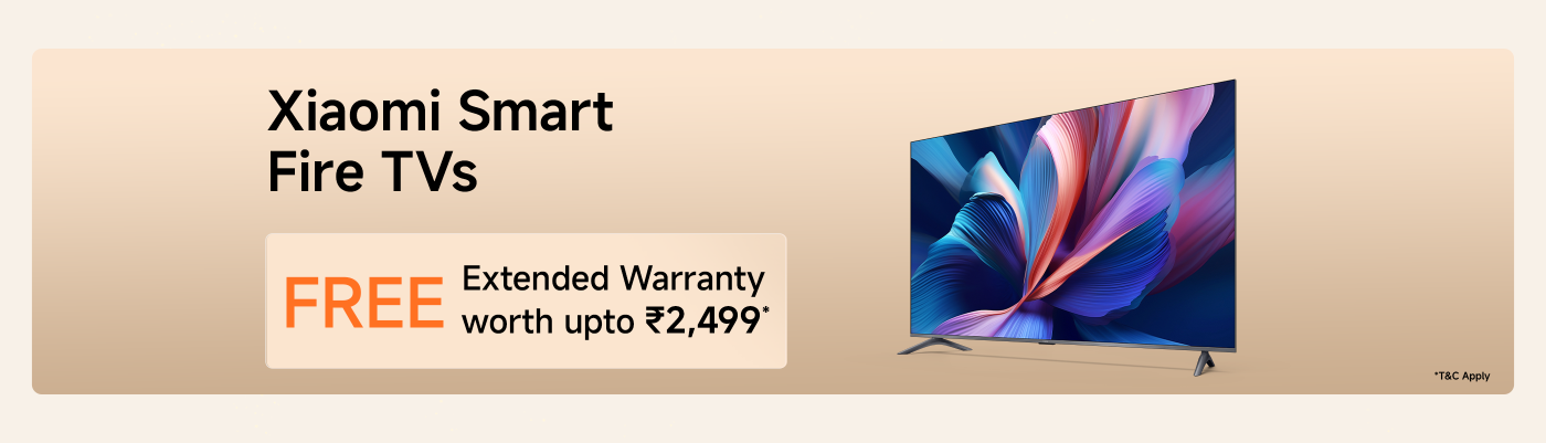 Xiaomi Smart Fire TVs promotion offering a FREE extended warranty valued at up to ₹2,499. The background features a vibrant, colorful design on the TV screen.