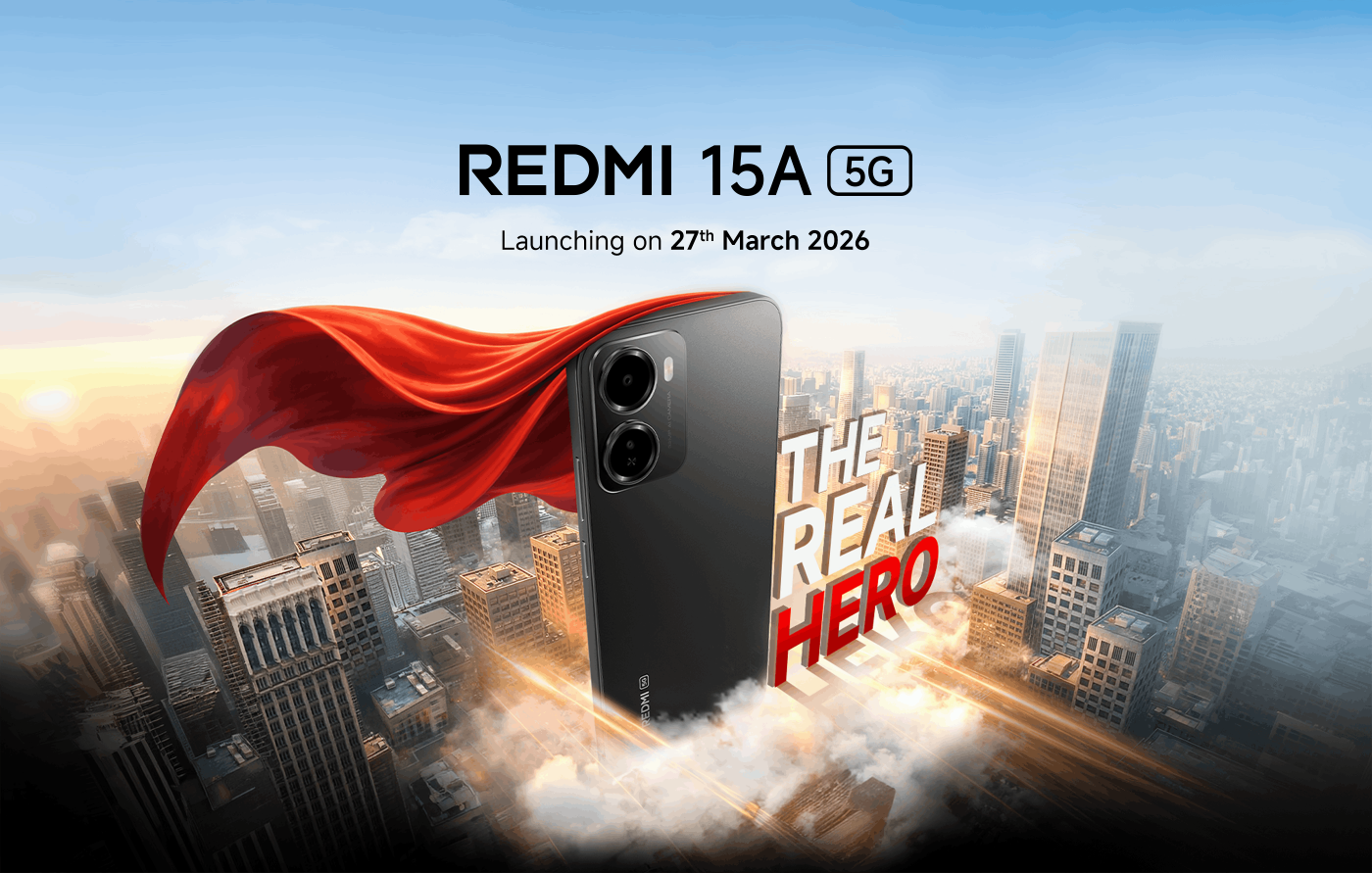 A promotional image for the Redmi 15A 5G smartphone, featuring a black phone with a red cape, against a city skyline backdrop. The text highlights its launch date, "27th March 2026," and proclaims "THE REAL HERO."